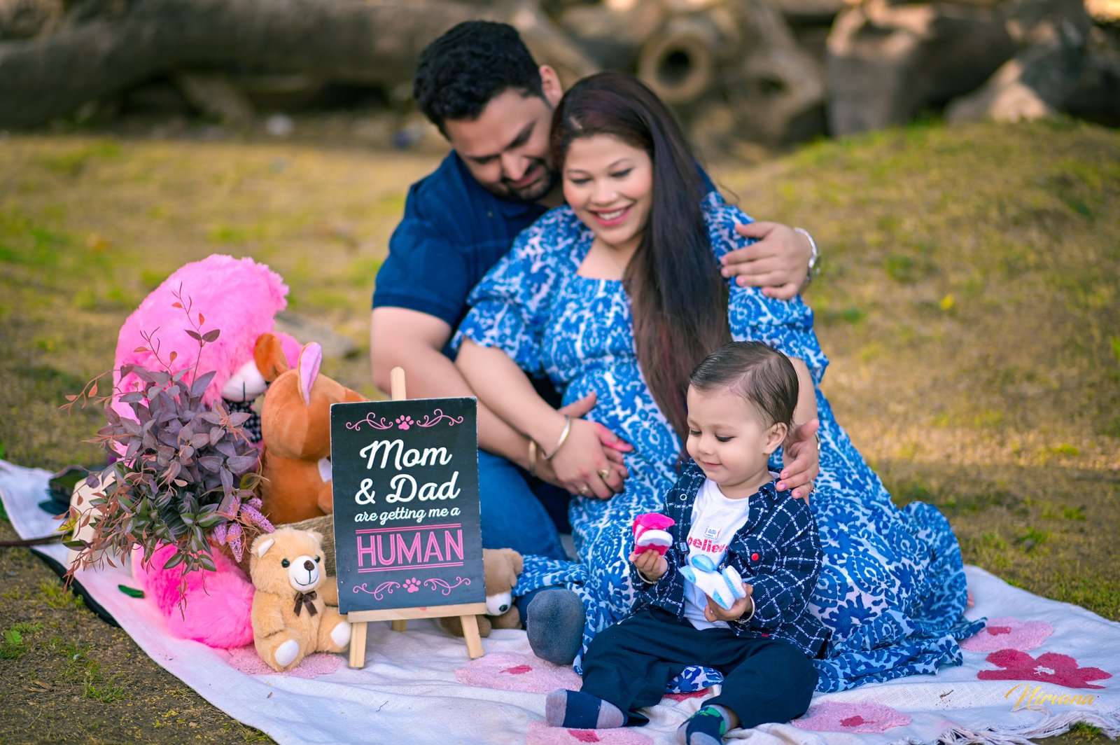 Parents and their baby sharing a joyful pregnancy announcement Parents and their baby sharing a joyful pregnancy announcement